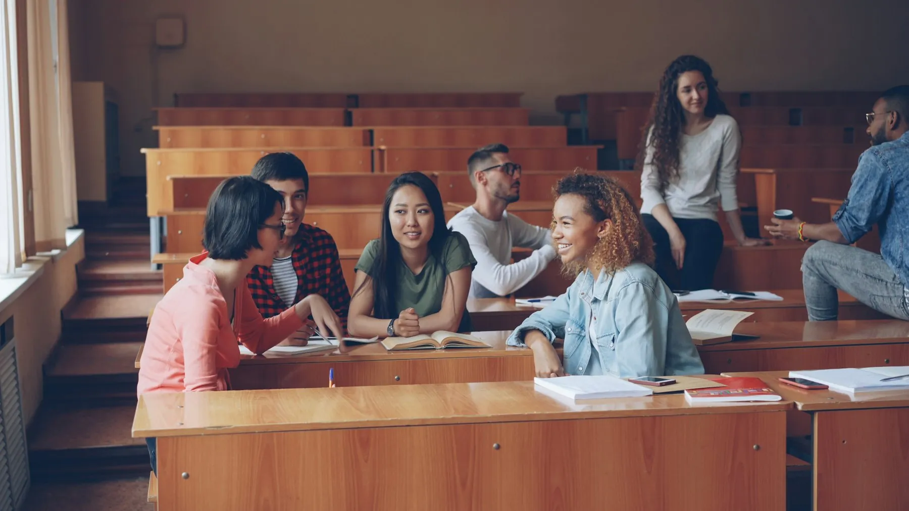 University students talking in a lecture hall